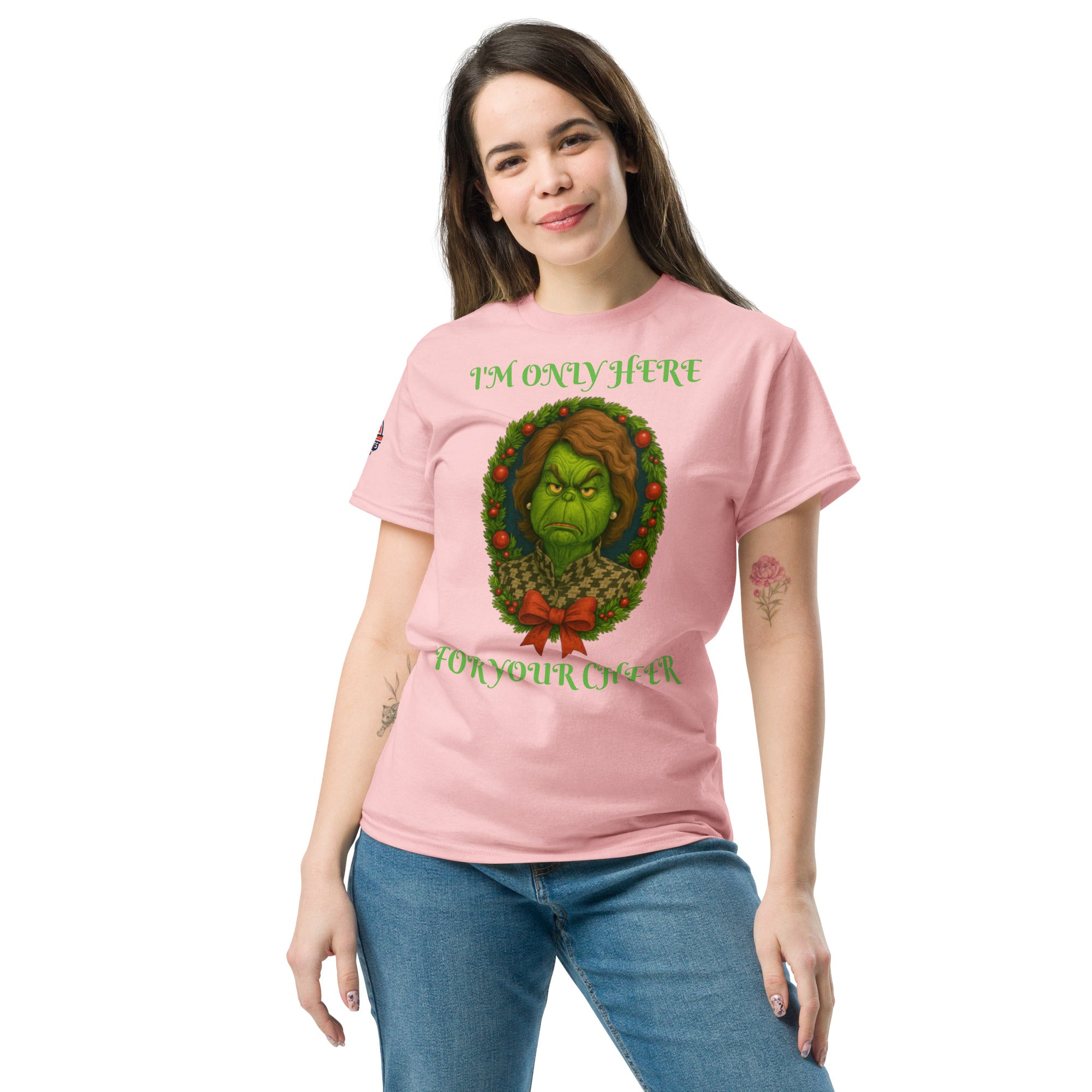 Woman wearing pink conservative Christmas shirt "I'm Only Here For Your Cheer' - funny political holiday apparel.