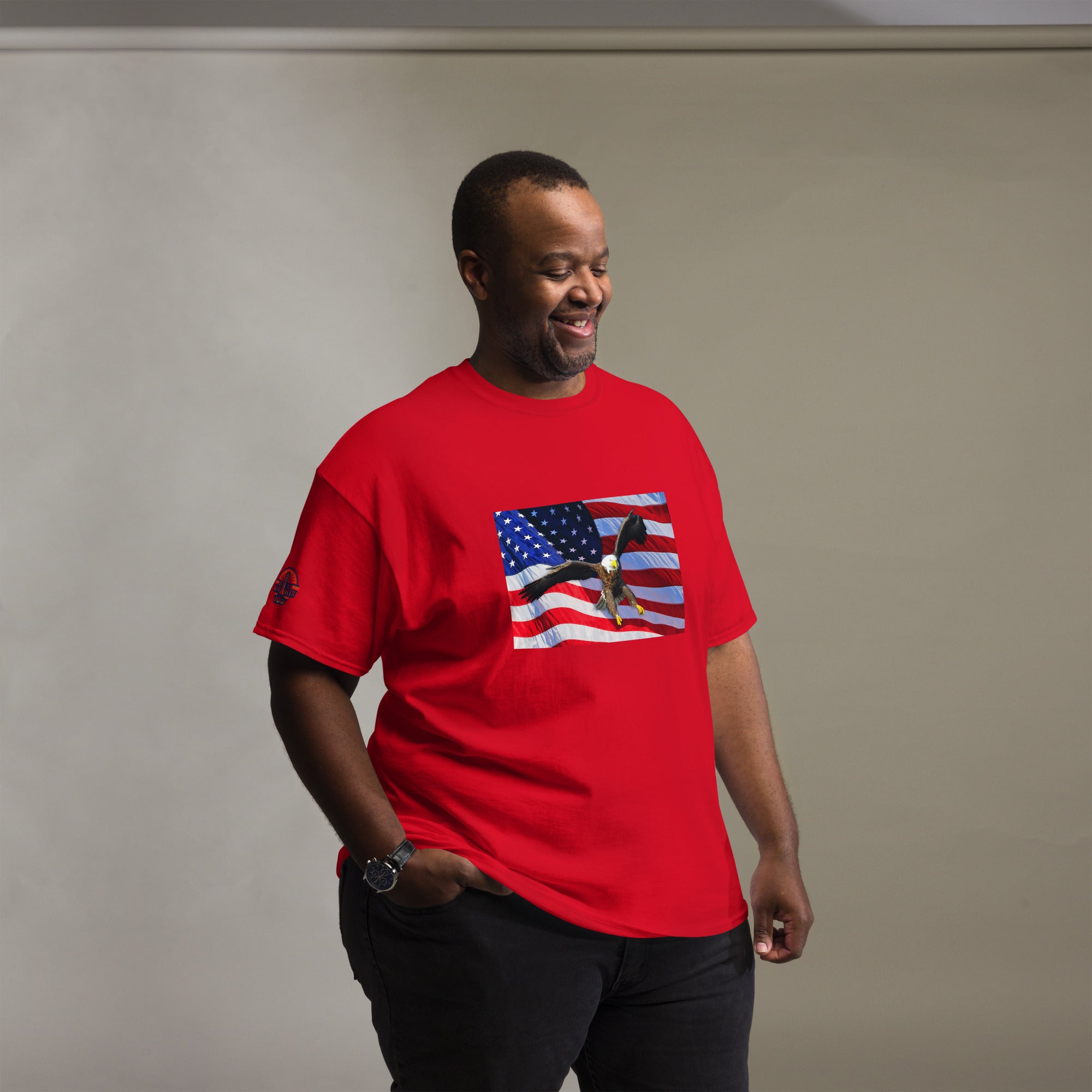 Man wearing a big and tall red t-shirt with an American flag and bald eagle design.