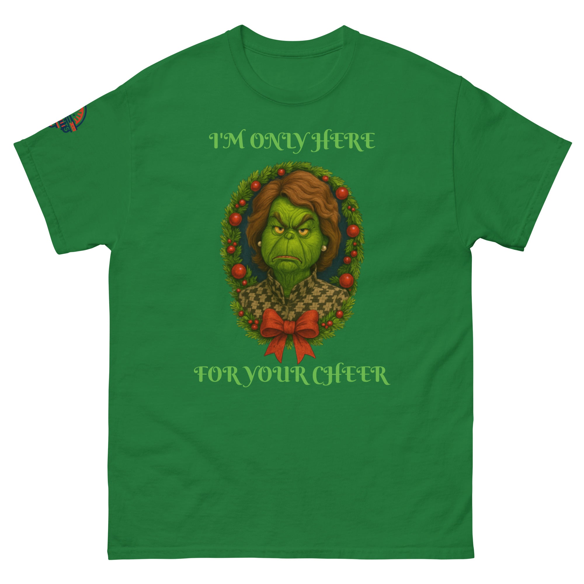 Flat lay green unisex Christmas T-shirt with "I'm Only Here For Your Cheer" political holiday wreath design.